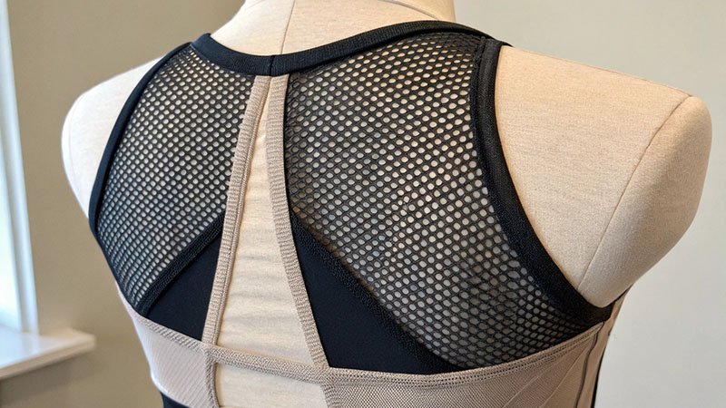 Tracksuit with integrated mesh panels for ventilation