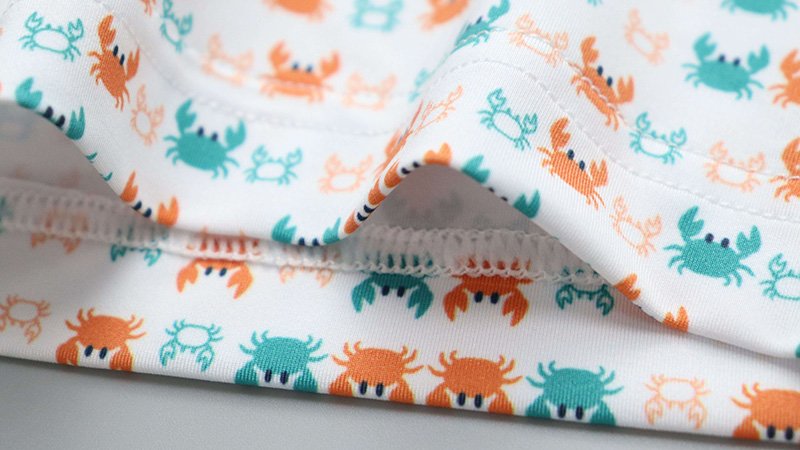 A detailed shot of reinforced stitching on a golf polo collar and placket