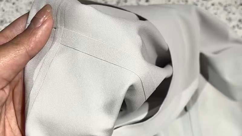 a close-up of a stitch-free bonded hem on a modern running short