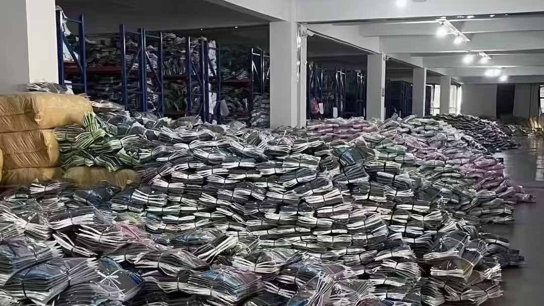 a large warehouse filled with boxes of finished apparel ready for shipping