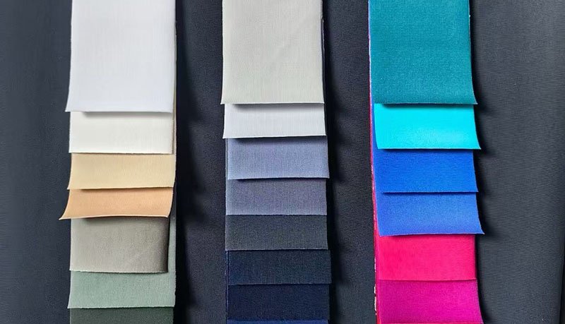 an infographic with four icons representing moisture-wicking, stretch, durability, and breathability